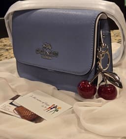 Beautiful COACH camera bag with Cherry bag charm/key chain