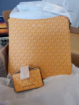 Bring in some sun with this Michael Kors Multi Comb Crossbod
