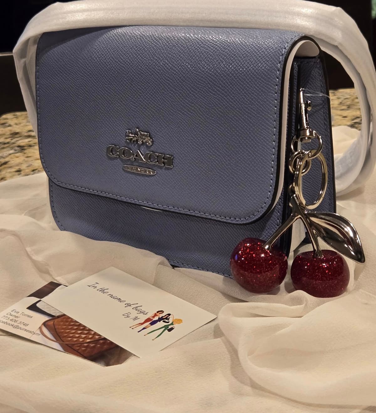 Beautiful COACH camera bag with Cherry bag charm/key chain